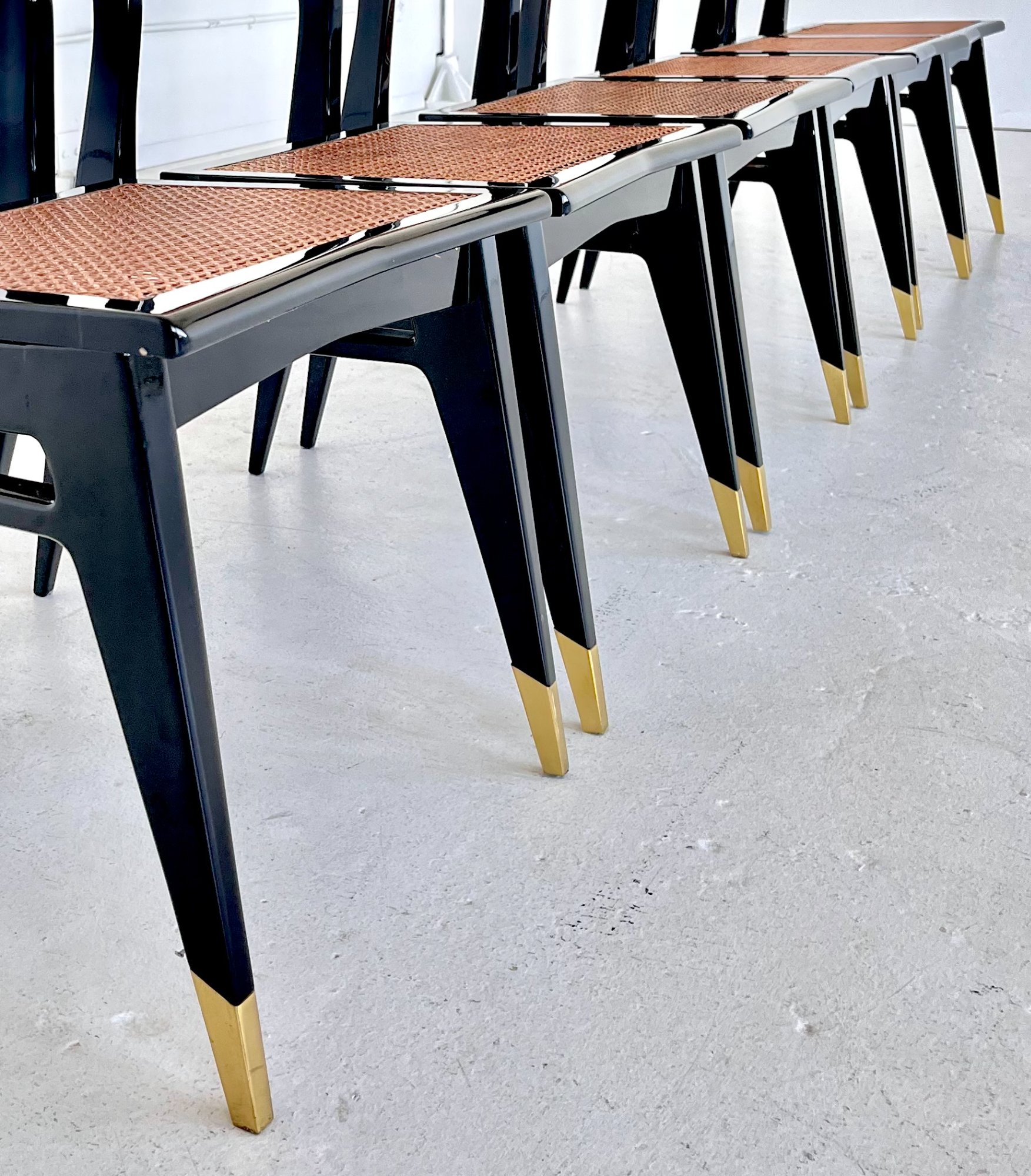 Ebonised dining chairs with cane seats